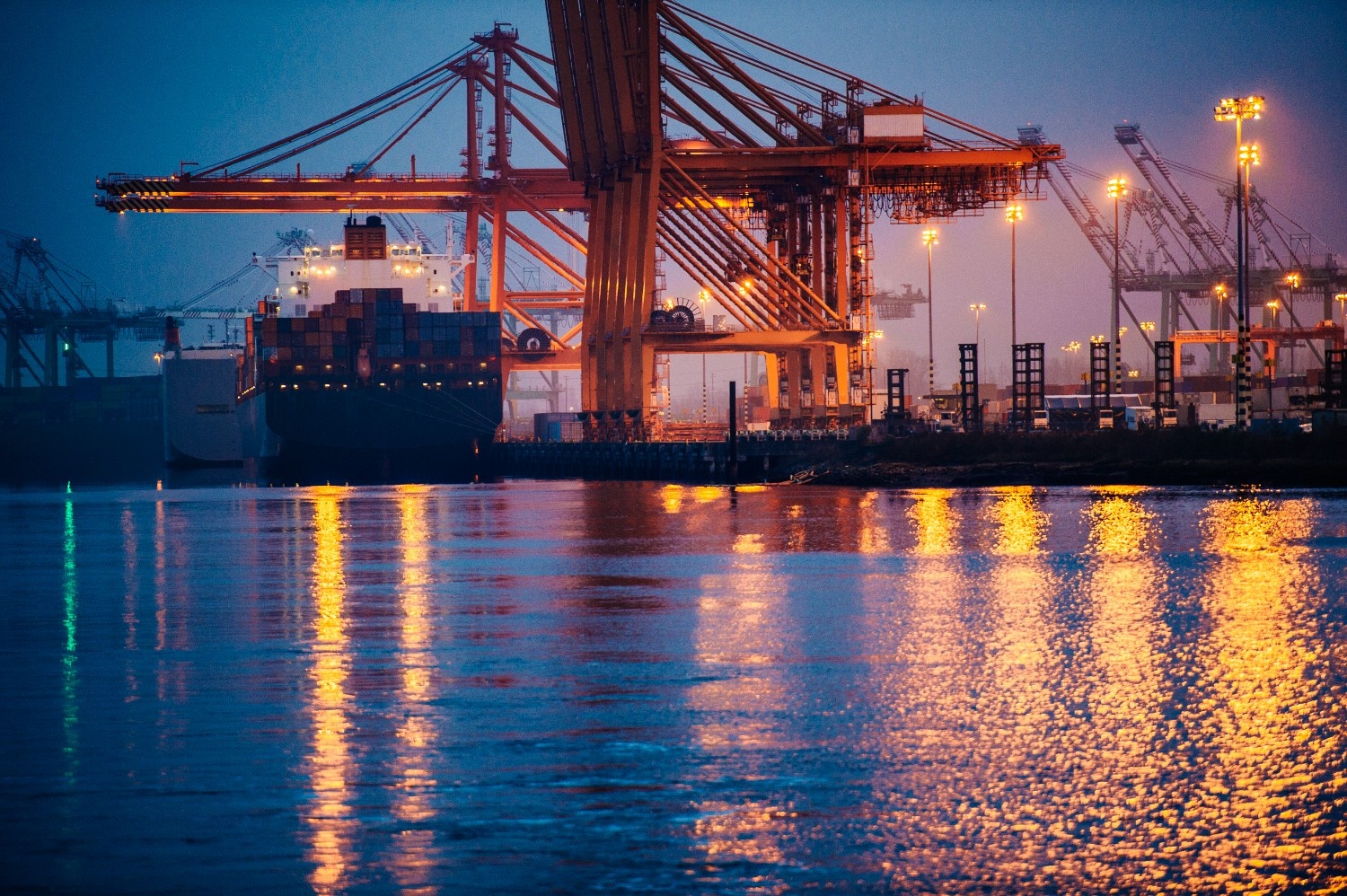 view of cargo ship and gantry cranes in harbor at 2025 04 03 08 04 10 utc 1